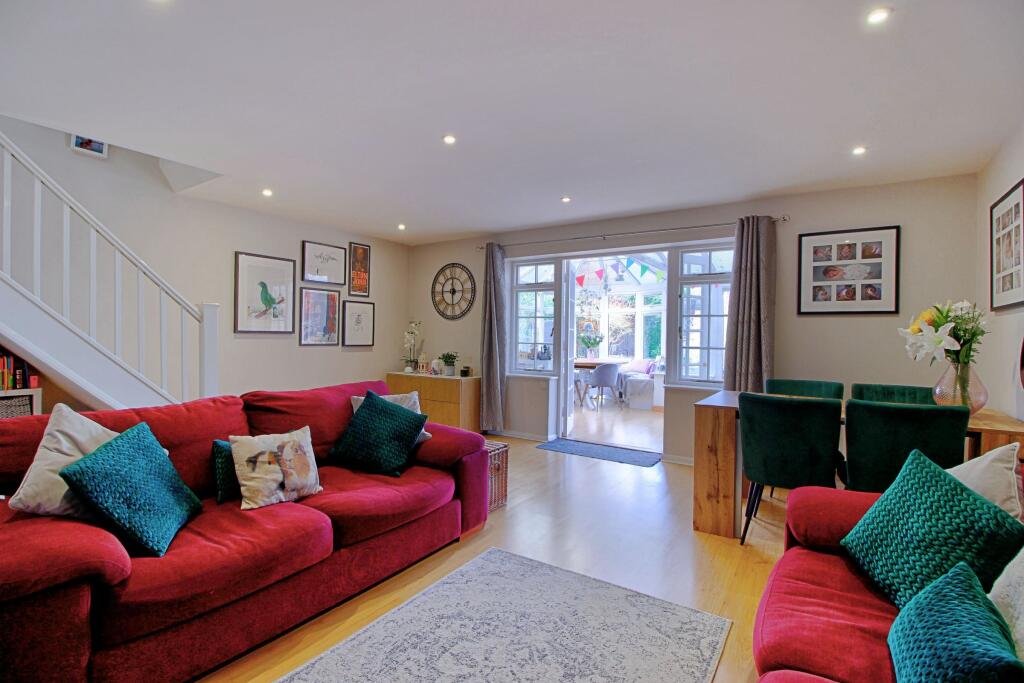 Double doors open to conservatory