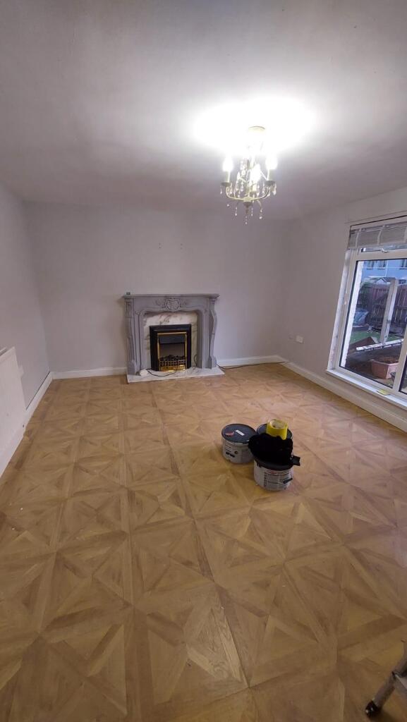 Spacious and well-lit living room with a large ...