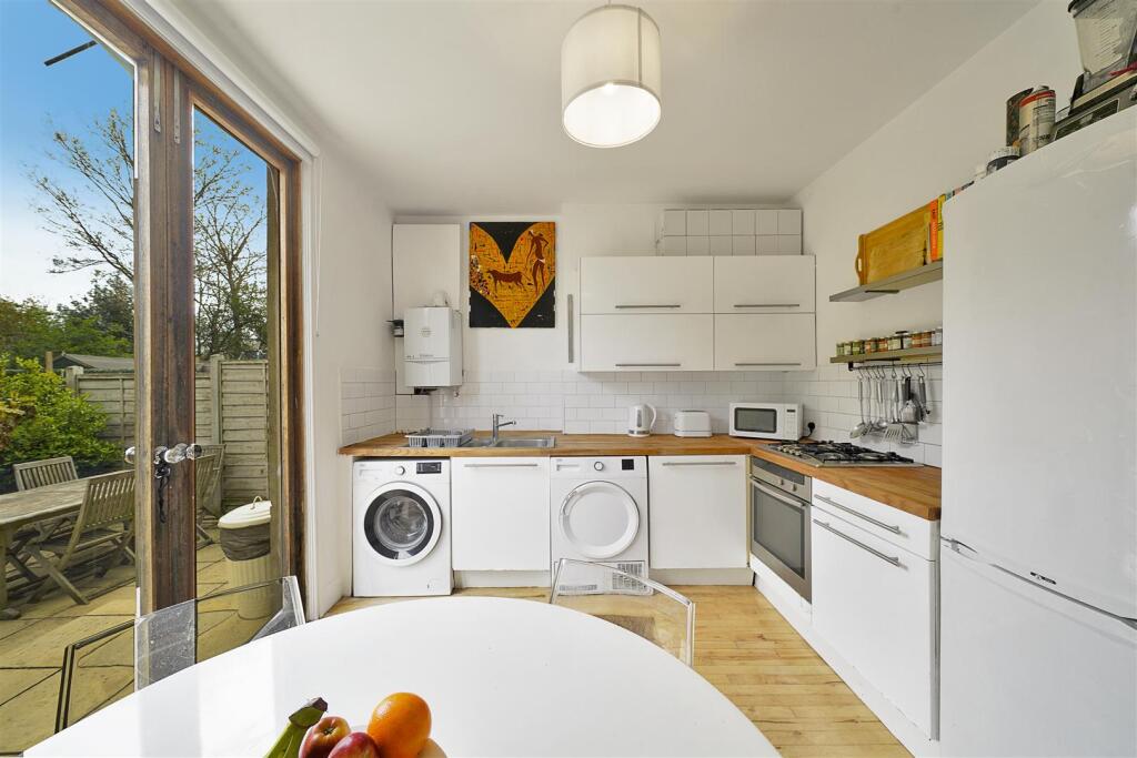 French doors leading out to garden from eat in kit