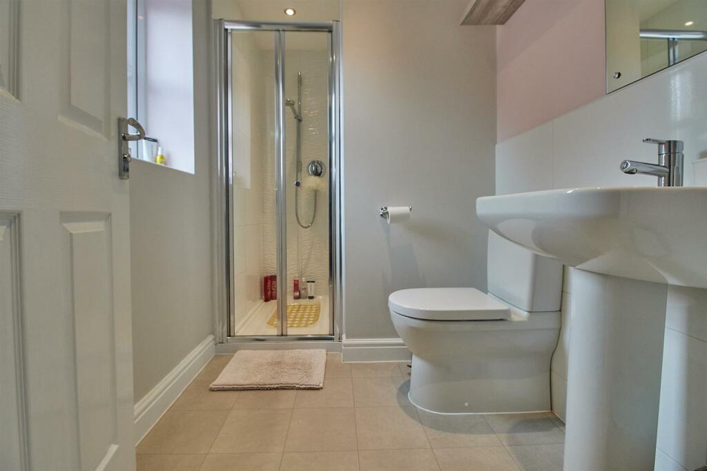En suite shower room to rear