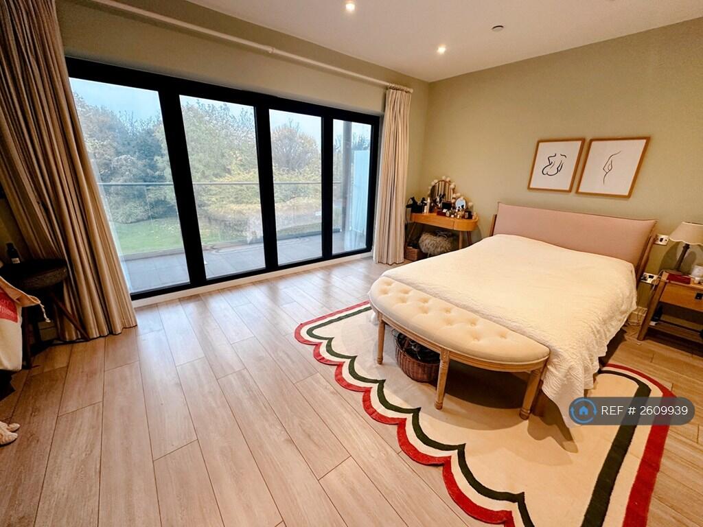 Master Bedroom And Access To Upstairs Balcony