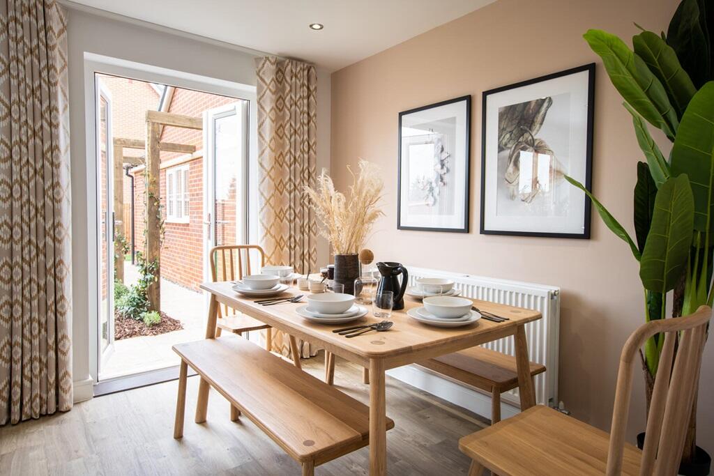 Double doors lead out to the garden from the dining area