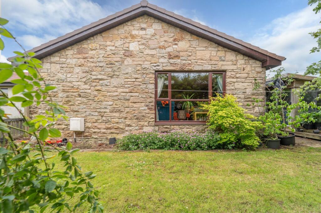 Side Of Property With Garden Room