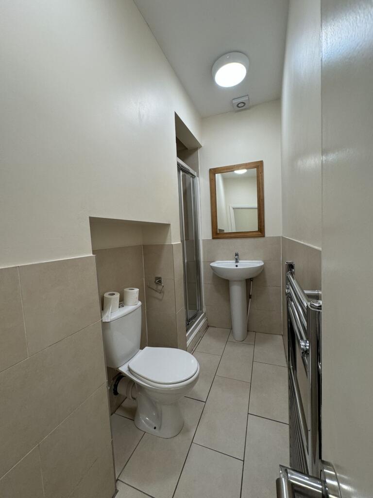 A clean, well-maintained bathroom featuring a t...
