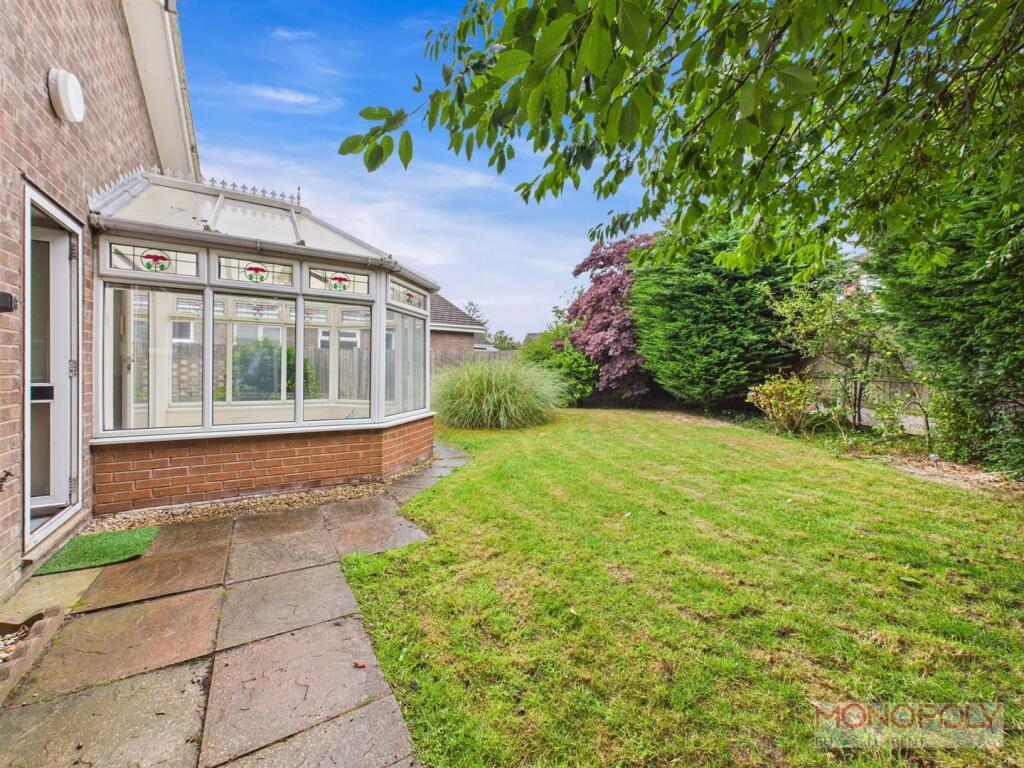 OUTSIDE TO TO THE REAR