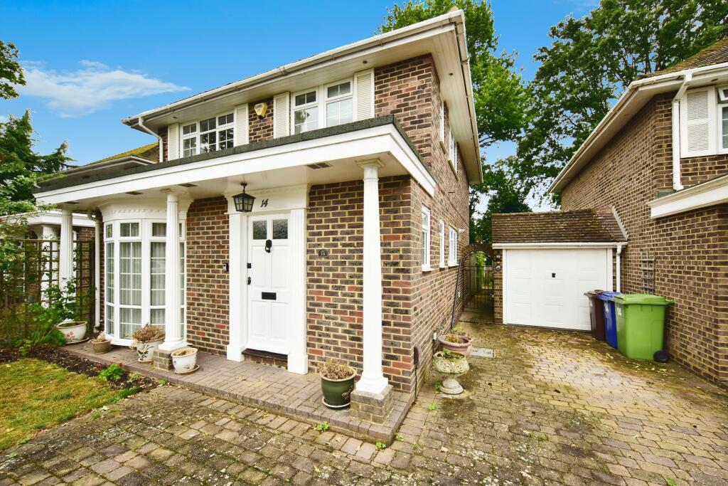 Front View Of The Property With Garage