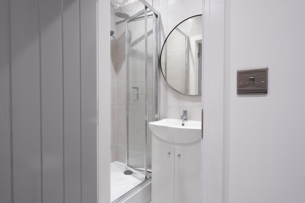 A modern bathroom featuring a sleek design with...