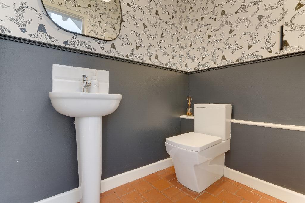 Handy cloakroom by stairs