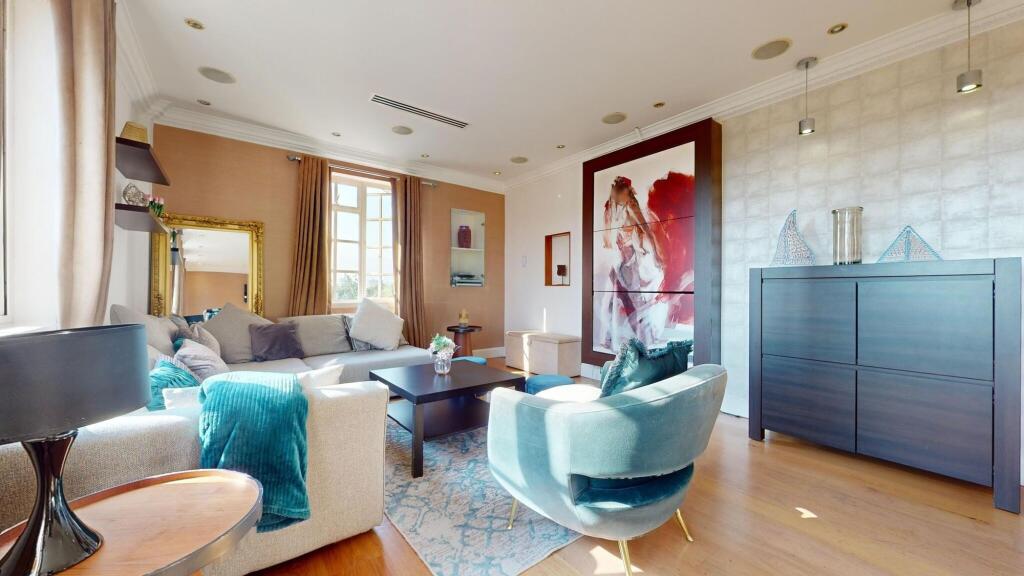 A bright and spacious living room featuring a l...