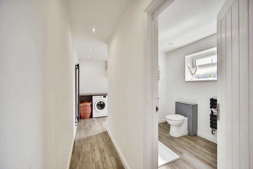 Utility View With Downstairs Modern Bathroom