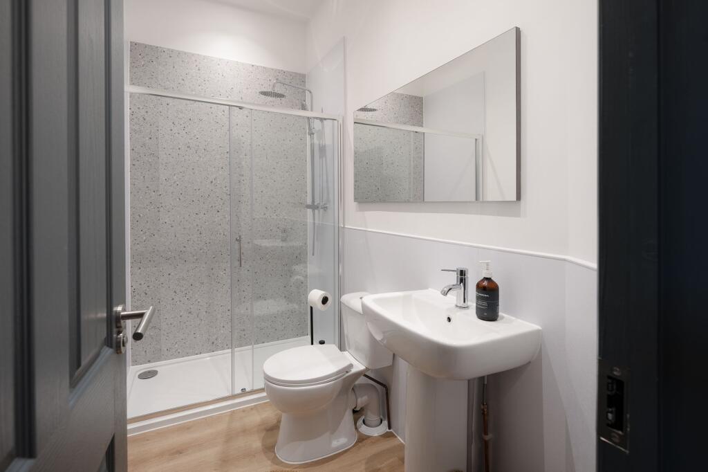 Modern, well-fitted bathroom with a walk-in sho...