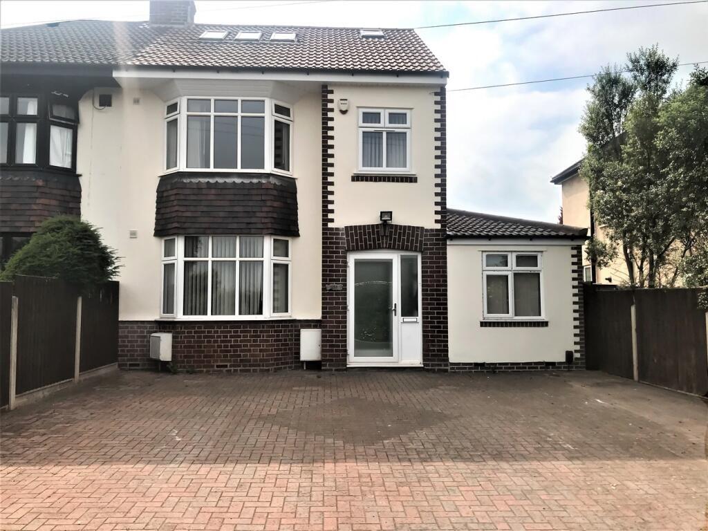 Charming front view of a spacious property, fea...