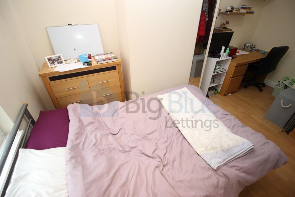 Cozy double bedroom featuring a comfortable dou...