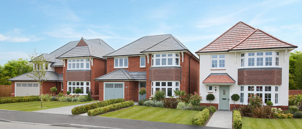 Three modern detached houses with bay windows, well-maintained gardens, and a blue sky in a suburban