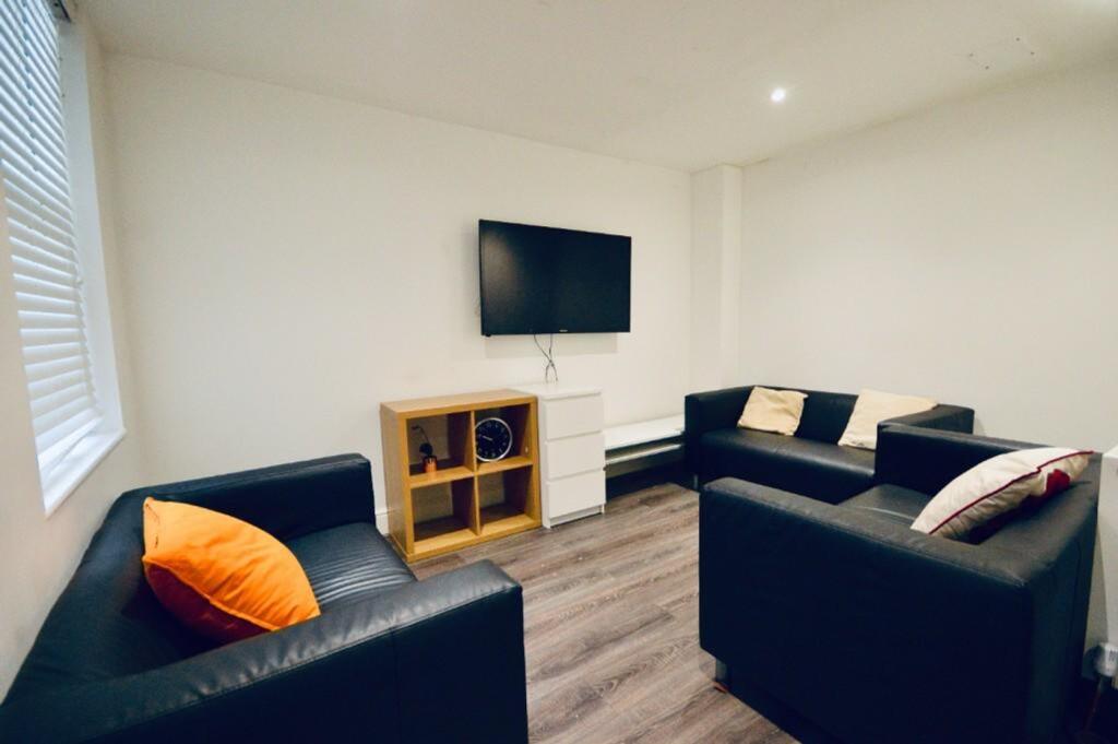 A modern and inviting living room featuring com...