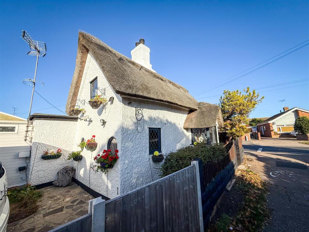 SIDE VIEW OF COTTAGE