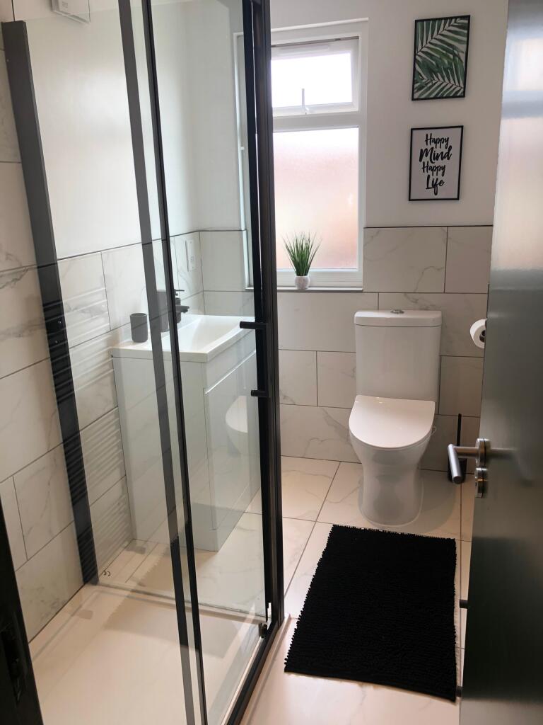 A modern and clean bathroom featuring a stylish...