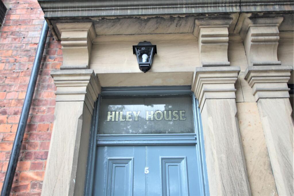 Elegant entrance door to Riley House featuring ...