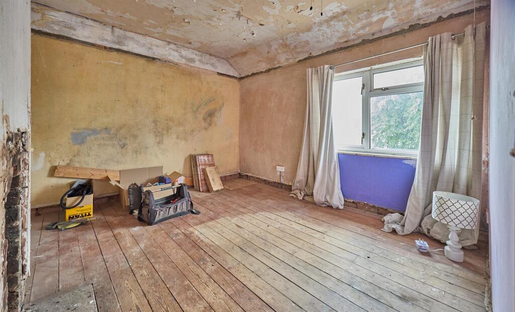 BEDROOM ONE TO REAR