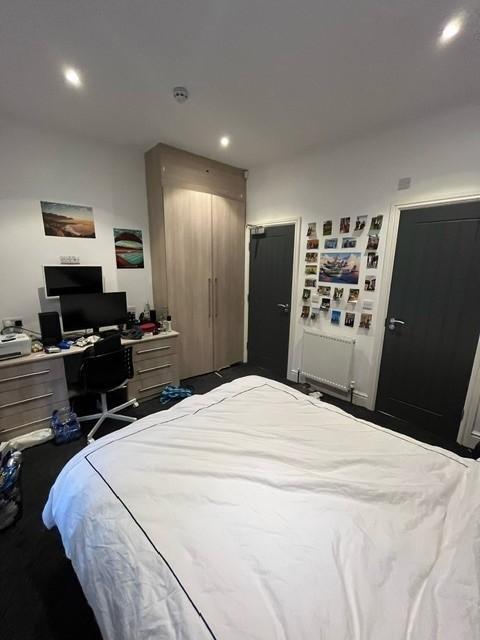 Bright, modern bedroom with built-in wardrobe, ...