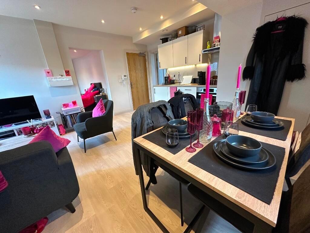 A modern and stylish living room with a cozy se...