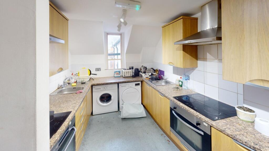 Bright and functional kitchen featuring ample c...