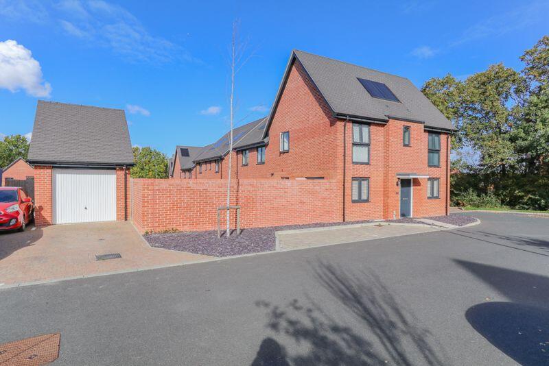 Front of Property with Garage and Par...
