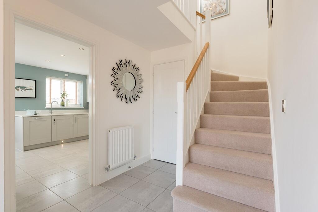 Central hallway with handy storage cupboard