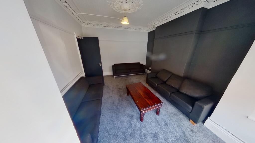 A contemporary living room featuring two large ...