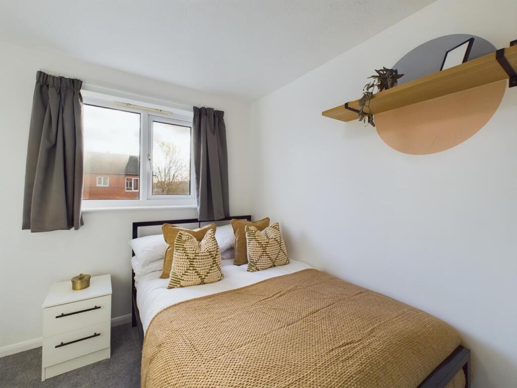 A beautifully decorated double bedroom featurin...