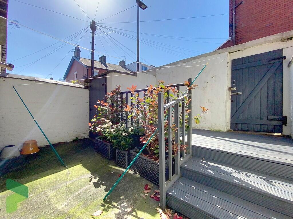 Rear yard with de...