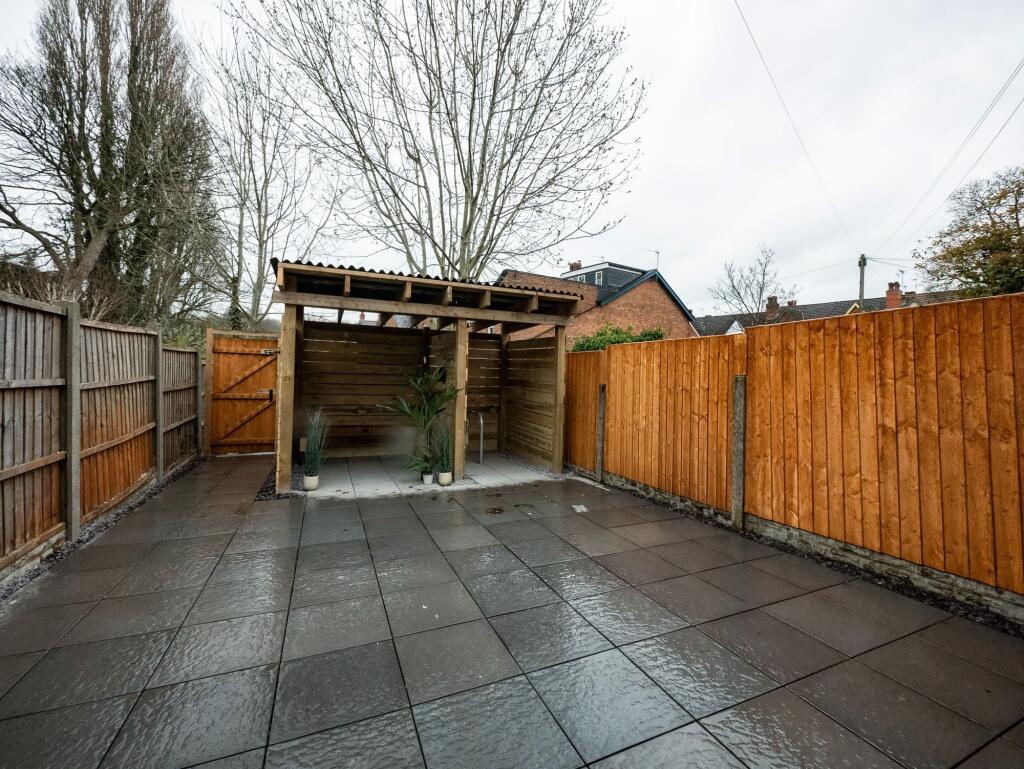 A neatly maintained, private outdoor garden are...