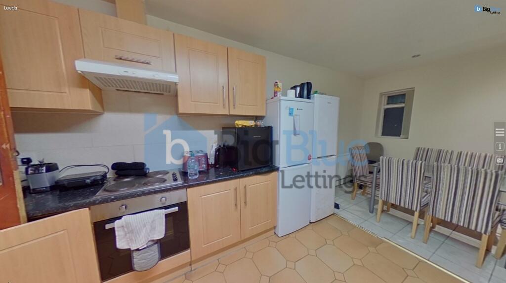 Bright and functional kitchen featuring ample w...