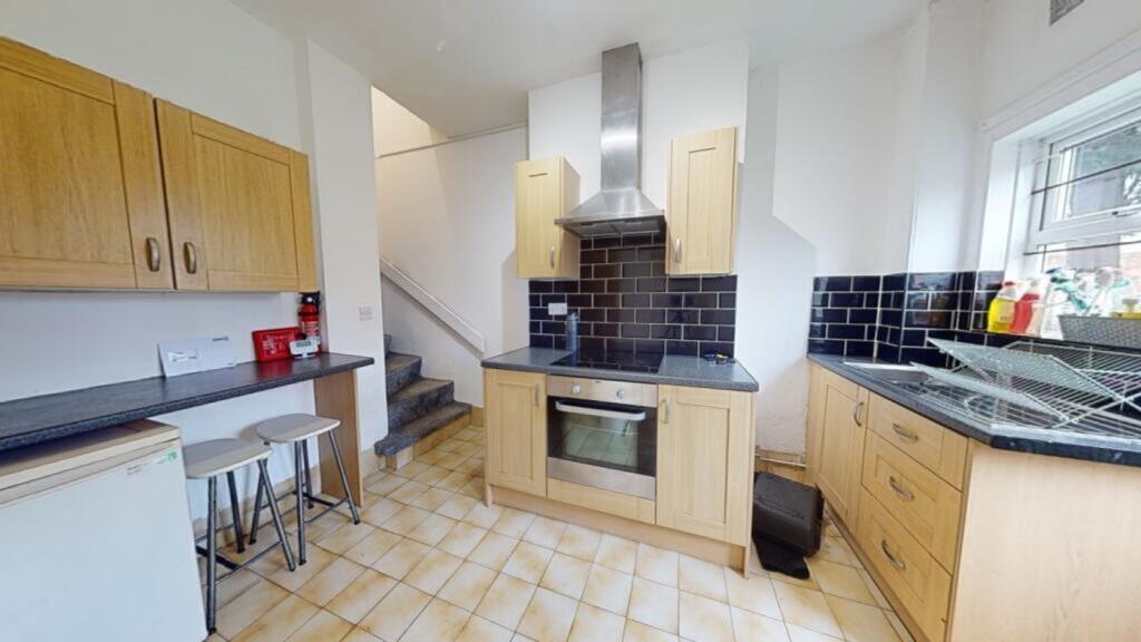 A spacious and inviting kitchen with modern app...