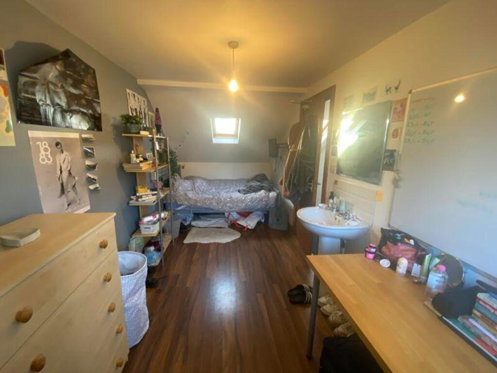 A spacious and inviting double bedroom with amp...