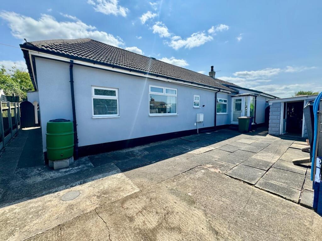 Rear Patio with access to front and workshop