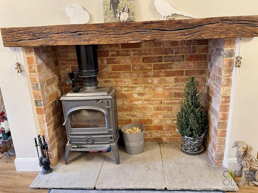 LOG BURNER IN STONE FIREPLACE.jpg