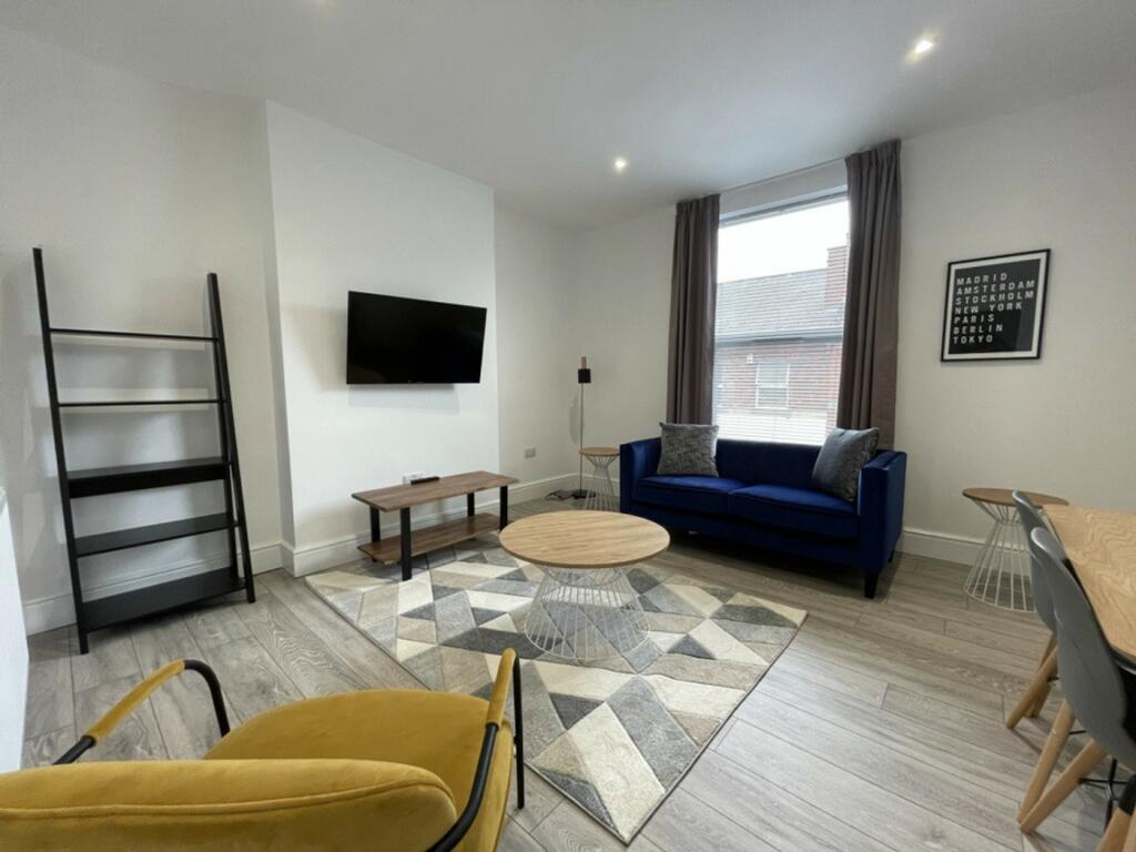 A spacious and stylish modern living room with ...