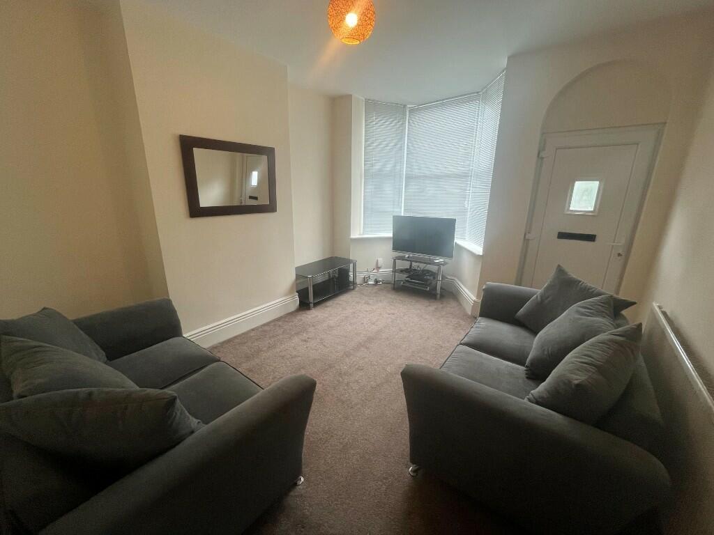 A comfortable living room featuring two plush s...