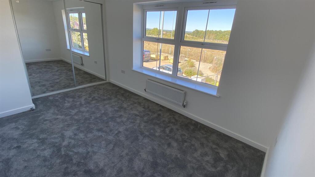 Bedroom 2 (with fitted sliderobes)