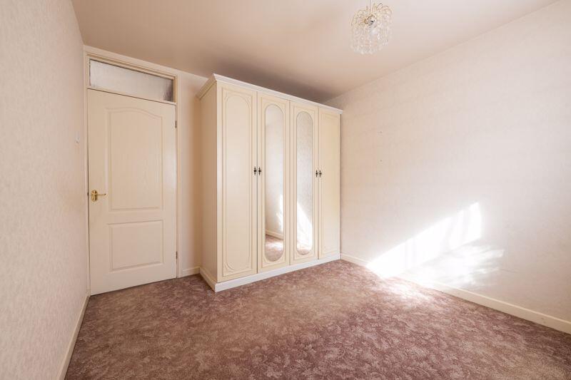 BEDROOM with fitted wardrobes