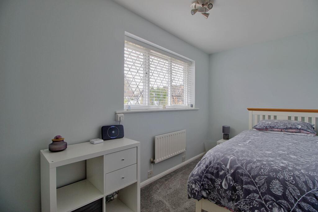 Bedroom Three has built-in wardrobe