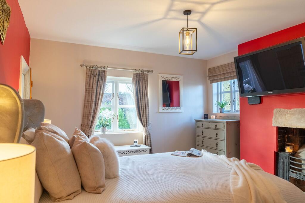 Bedroom 3 with original fireplace