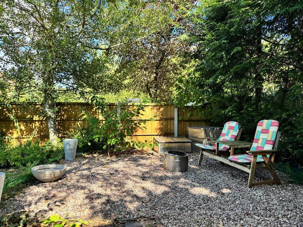Secluded seating area at rear of garden