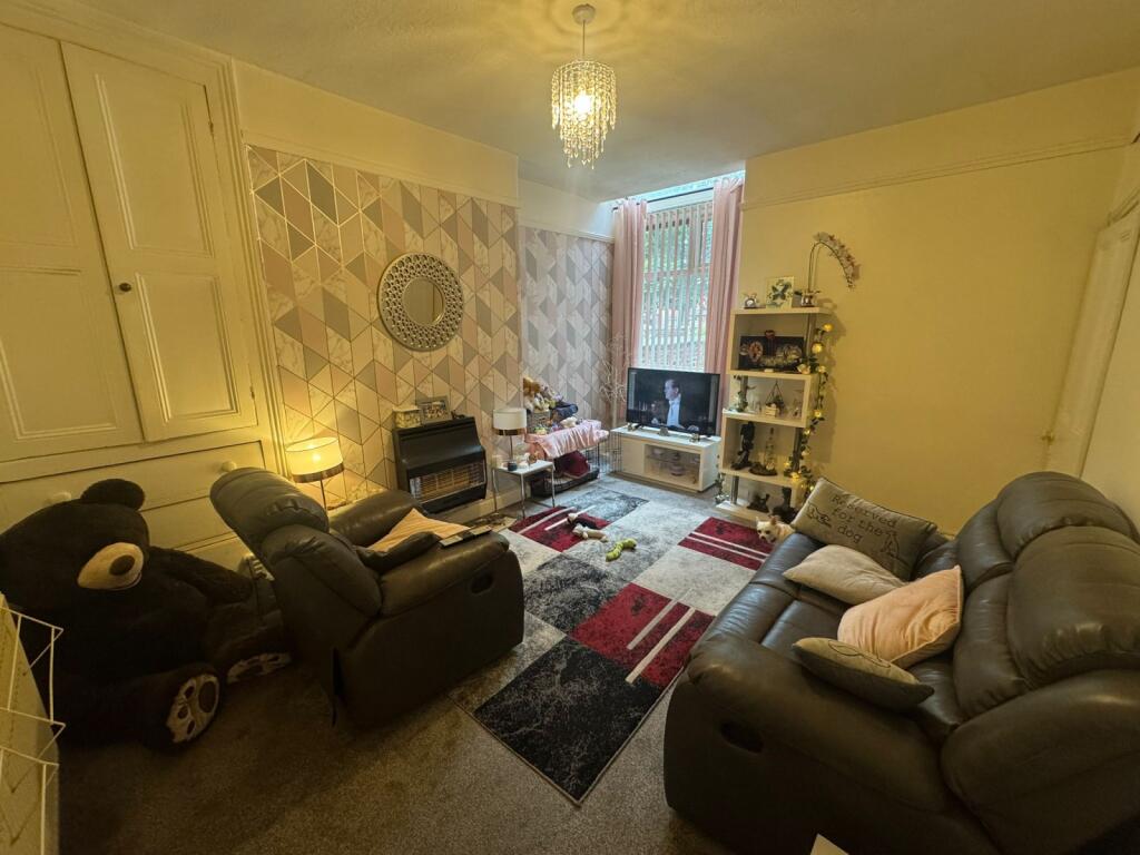A cozy living room featuring comfortable leathe...