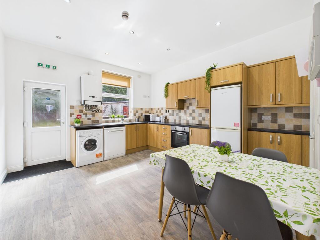 Bright and modern kitchen with ample natural li...