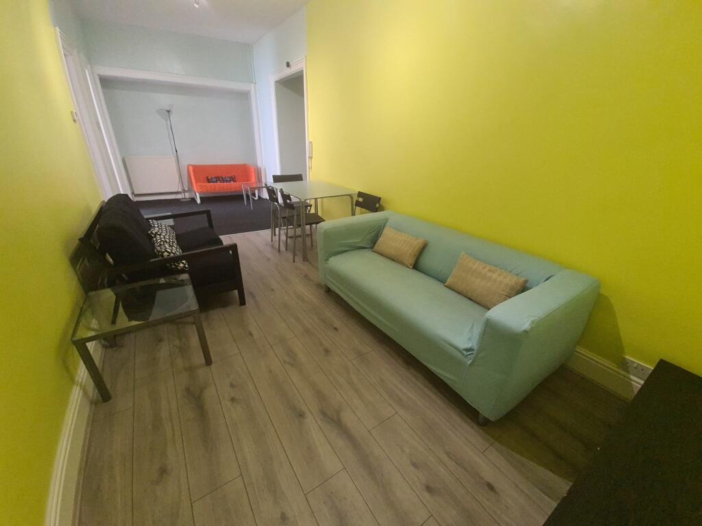 A bright and contemporary living room with a li...