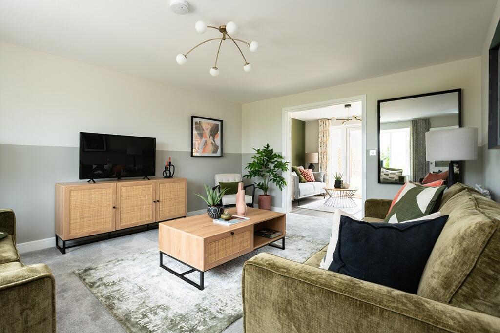 A welcoming &amp; cosy living area with connecting doors to the kitchen