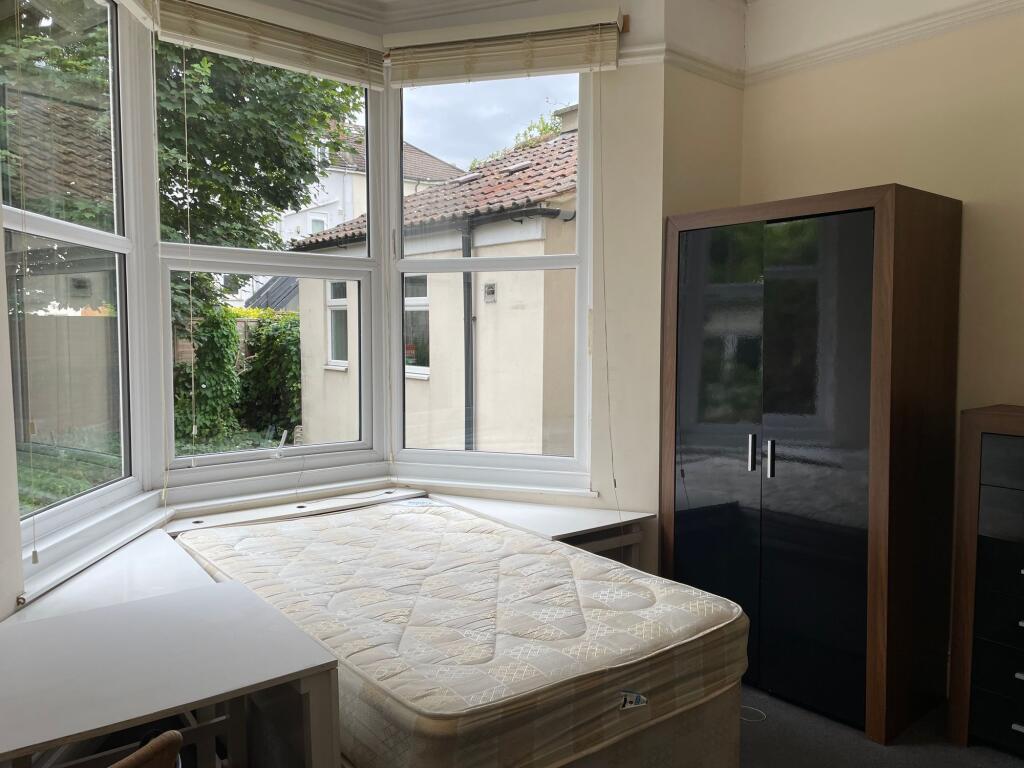 Bright and spacious double bedroom featuring la...