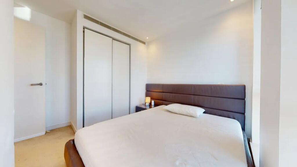 A modern double bedroom featuring a comfortable...